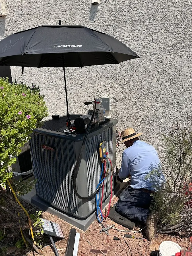 HVAC technician performing outdoor AC maintenance in Wytheville